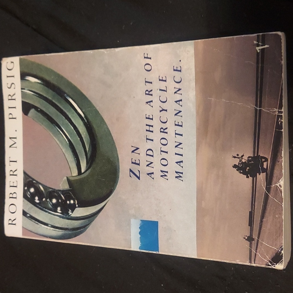 Paper back copy of zen and the art of motorcycle maintenance unforgettable trip